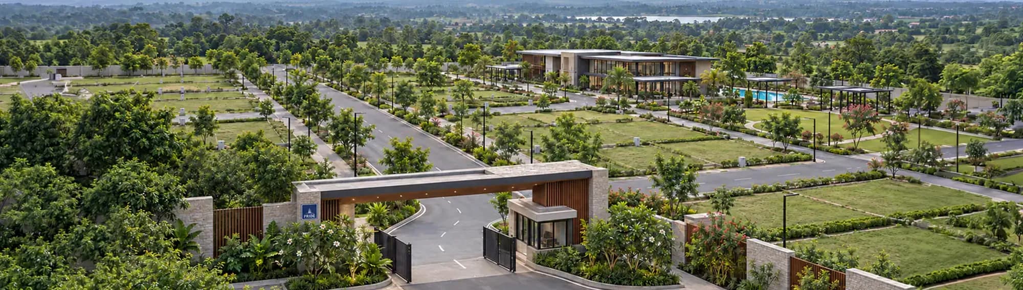 Aerial view across the layout, with the entrance and clubhouse