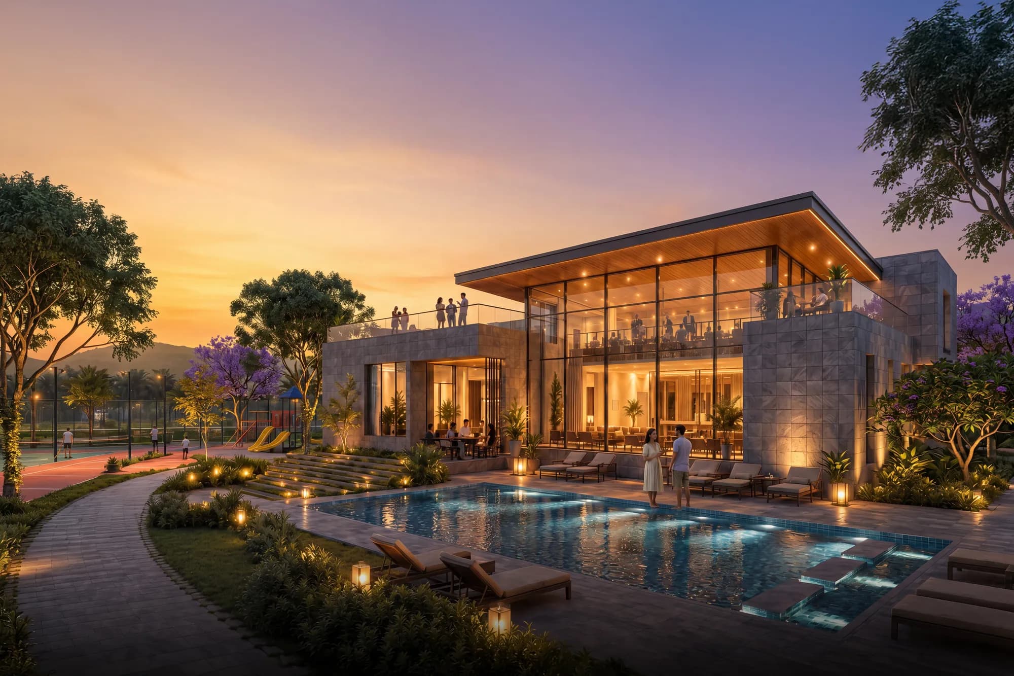 The clubhouse and swimming pool lit up at dusk